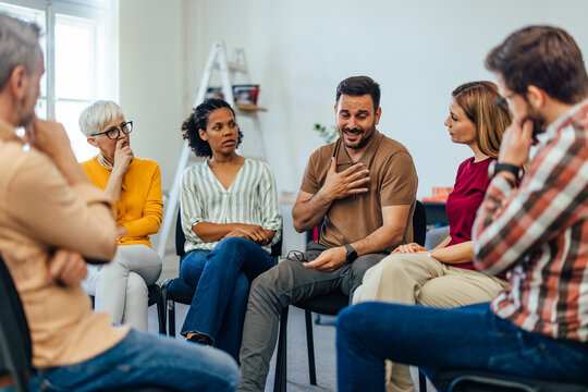 An upset man told his problems, looking emotional during the group therapy.