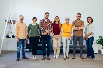 Obraz premium Smiling people looking at the camera, standing next to each other.