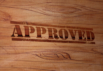 Approved Stamp on a Wooden Surface
