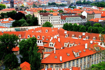 Naklejka premium Prague, Czech Republic. Mala Strana, Lesser Town of Prague. Top view of downtown, panorama, old buildings with red tiled roofs, church, tower, castle