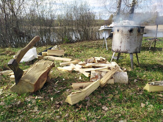 Firewood and an axe in the woods. Axe and lots of firewood, wood, wood, chop, chop, fuel, work, industry, material, raw material, heat, renewable energy, saw, forestry. Cooking in the woods.