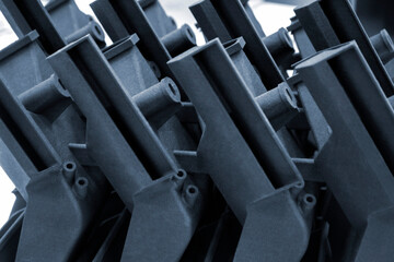 Models printed on 3D printer. Objects details printed on 3D printer from plastic close-up. Prototypes of shapes made by 3d printer. Concept new modern printing technology