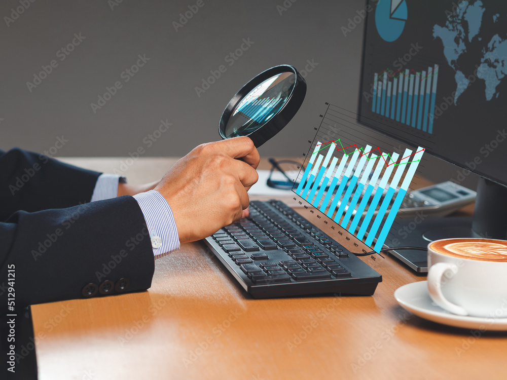 Poster businessman looking at statistical information comparing data in charts graph with a magnifying glas