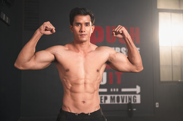 Asia sport man with beautiful muscles at fitness gym