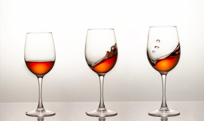 Three glasses of red wine. Red wine in a glass, close-up, studio shot