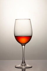 Red wine in a glass, close-up, studio shot