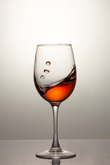 Red wine in a glass, close-up, studio shot