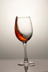 falling glass with red wine, motion blur, blur
