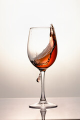 Red wine in a glass, close-up, studio shot