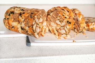 Sliced dumpling on white kitchen pad.