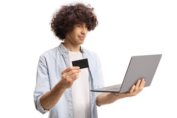 Casual guy using a credit card and a laptop computer