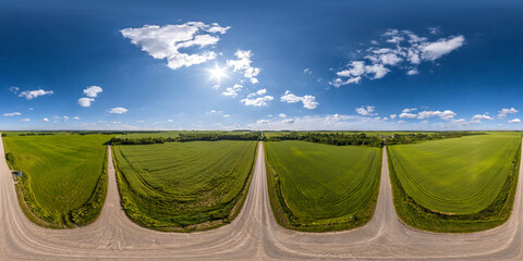 full seamless spherical aerial hdri panorama 360 view on crossroads of no traffic gravel road...