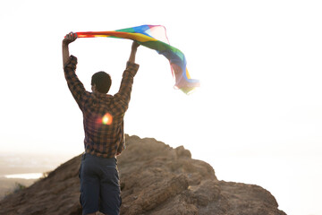 Happy man with a pride flag. LGBT community..