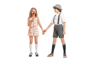 Portrait of little boy and girl, charming kids retro style outfit, fashion of 70s, 80s years isolated on white studio background with copy space for ad.