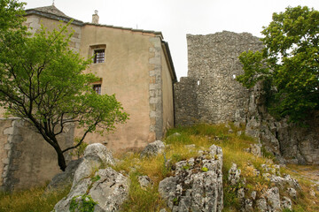 The exterior of Rocca di Monrupino near Trieste in Friuli-Venezia Giulia, north east Italy, showing the Casa della Comunanza right, and the Sanctuary of Monrupino or Santuario di Santa Maria Assunta l