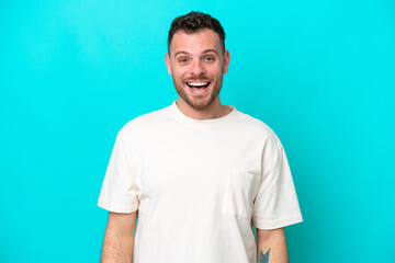 Obraz premium Young Brazilian man isolated on blue background with surprise facial expression
