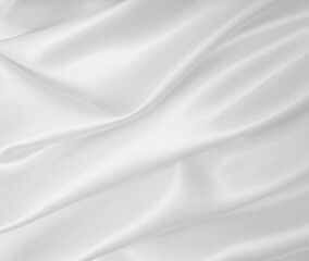 Smooth elegant white silk or satin luxury cloth texture as wedding background. Luxurious background design