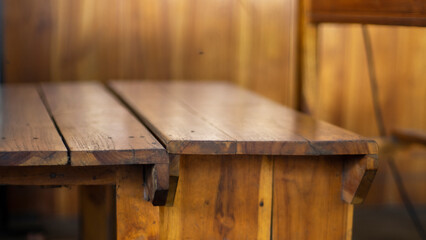 Blurry abstract image of wooden table from side