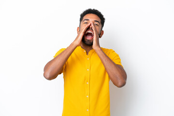 Young Brazilian man isolated on white background shouting and announcing something