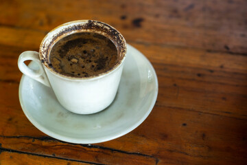 Black coffee on wooden table