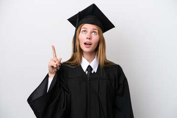 Young university graduate English woman isolated on white background pointing up and surprised