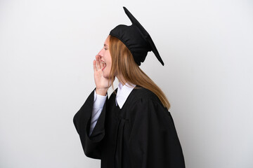 Young university graduate English woman isolated on white background shouting with mouth wide open to the lateral