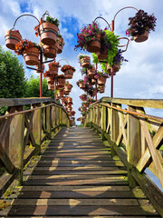 Arched footbridge with hanging baskets