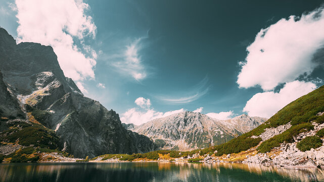 Tatra National Park, Poland. Calm Lake Czarny Staw under Rysy And Summer Mountains Landscape. Beautiful Nature, Scenic View Of Five Lakes Valley. UNESCO World Heritage Site.