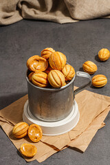 Cookies in the shape of walnuts with condensed milk cream filling.Delicious shortbread sandwiches