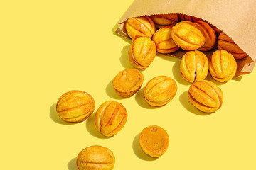 Cookies in the shape of walnuts with condensed milk cream filling.Delicious shortbread sandwiches