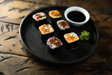 Assorted vegan sushi rolls with vegetables and tofu