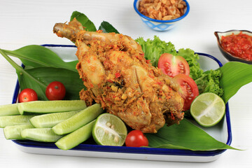 Ayam Betutu. Spicy Balinese Roast Chicken Stuffed with Cassava Leaves.