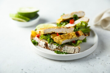 Grilled chicken sandwich with kale