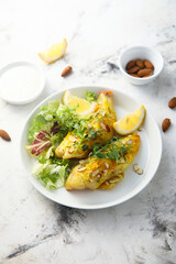 Roasted fish with almond flakes