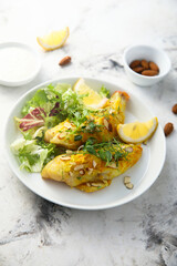 Roasted fish with almond flakes
