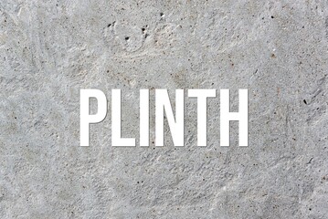 PLINTH - word on concrete background. Cement floor, wall.
