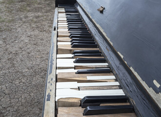 Keyboard of old shabby piano