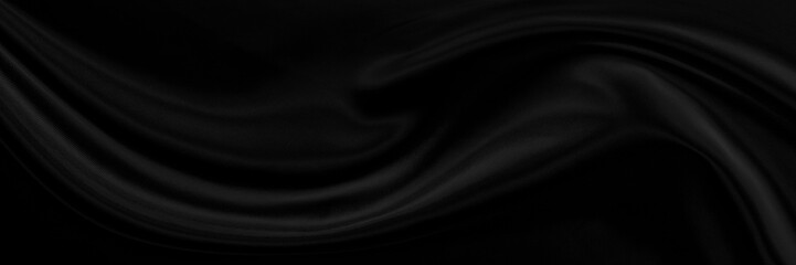 Black gray satin dark fabric texture luxurious shiny that is abstract silk cloth background with patterns soft waves blur beautiful.