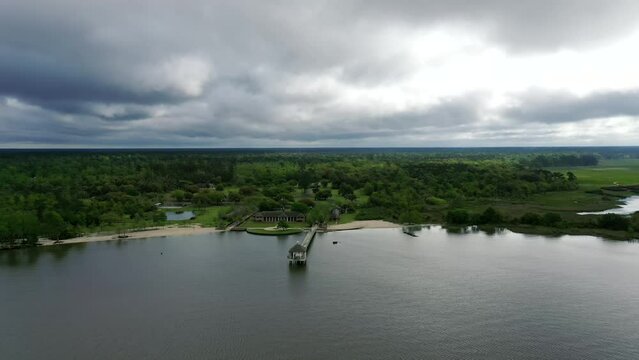 Evergreen Fontainebleau State Park And Serene Beach Pier In Mandeville Within The Basin Of Lake Pontchartrain, Louisiana. Wide Aerial