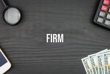 FIRM - word (text) and money dollars on the table, phone magnifying glass (loupe) and calculator. Business concept, buying goods and products, paying for services (copy space).
