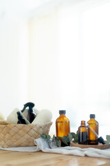 Essential oils in glass dark bottle. Skin and body care treatment concept. Eucalyptus branch.