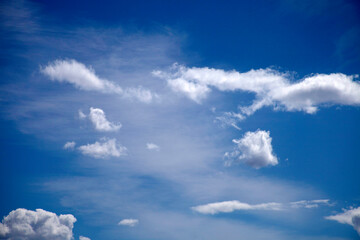 Naklejka na ściany i meble White clouds on blues sky
