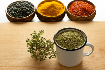 Types of spices. Roasted terebinth fruits. Thyme. Turmeric. Red powdered pepper.