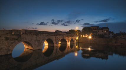 Augustus and Tiberius Bridge in Rimini at night