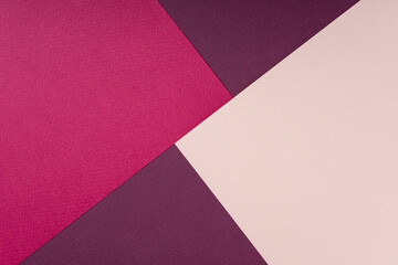 Geometric composition of colored textured paper in pink and coral shades. Creative abstract...