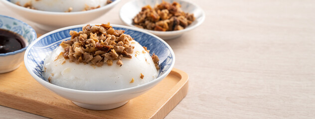 Obraz na płótnie Canvas Taiwanese savory rice pudding Wa gui with chopped dried radish and soy sauce