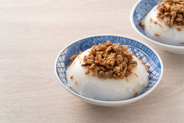 Taiwanese savory rice pudding Wa gui with chopped dried radish and soy sauce