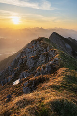 Top of mountain Gro&szlig;e Schlicke at sunrise with valley view of Schwangau and F&uuml;ssen. Tannheimer Valley, Tyrol, Austria
