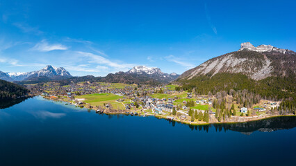 Naklejka premium Altaussee at the lake Altausseer See in the Salzkammergut, Styria. View to Hoher Sarstein and Loser mountains.