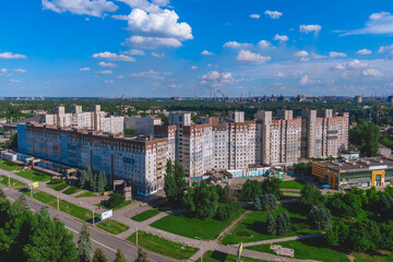 Fototapeta na wymiar A multi-storey building where the parents of President Zelensky live. in the background ArcelorMittal Krivoy Rog, Ukraine